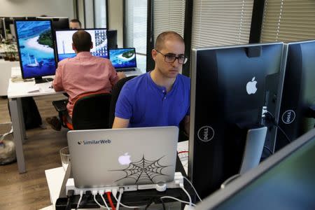 An employee works at Internet data firm SimilarWeb at their offices in Tel Aviv, Israel July 4, 2016. REUTERS/Baz Ratner