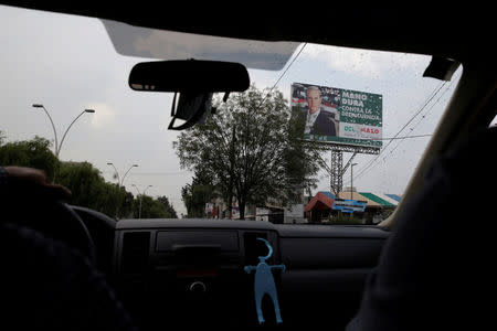 A billboard with the picture of Alfredo del Mazo of Institutional Revolutionary Party (PRI), candidate for governor of the State of Mexico, is seen in Metepec, State of Mexico, Mexico May 16, 2017. Picture taken on May 16, 2017. REUTERS/Carlos Jasso
