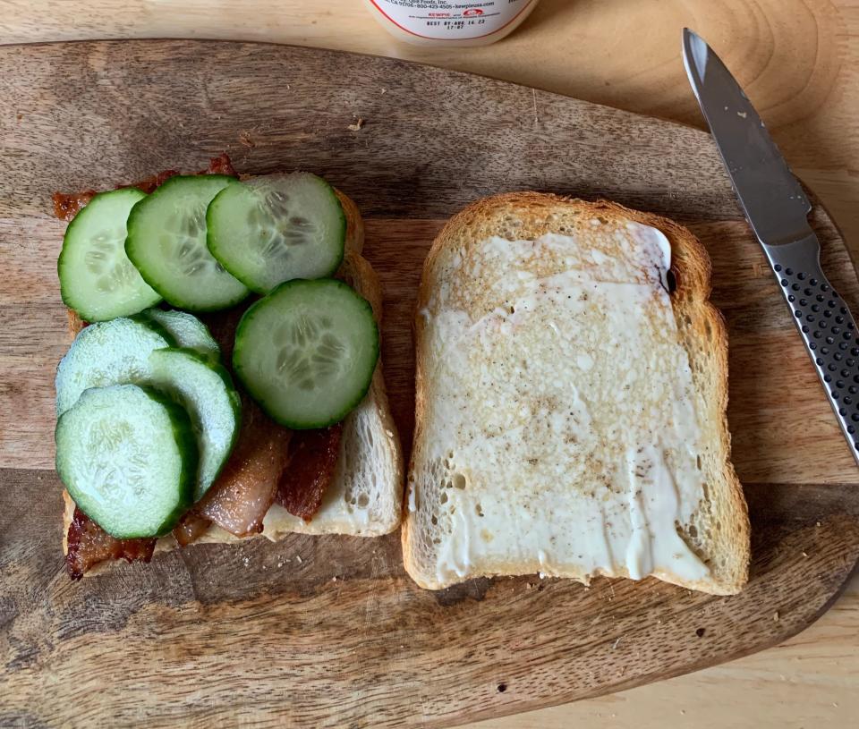 A tomato, bacon, and cucumber sandwich.