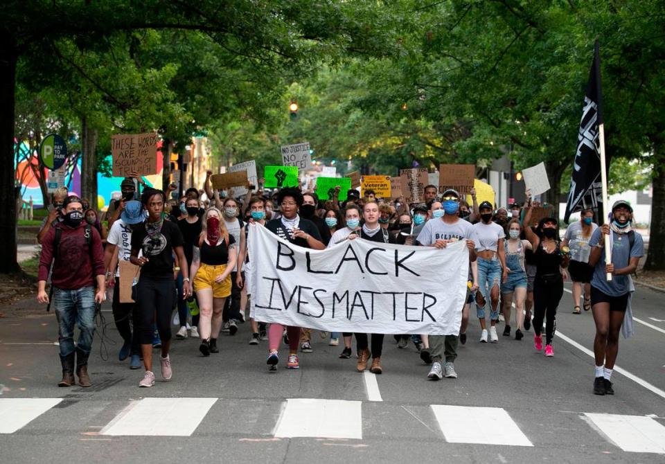 Protesters march from Moore Square up Blount Street to The Executive Mansion honoring those who died or faced excessive force at the hands of Raleigh police on Tuesday, June 9, 2020 in Raleigh, N.C.