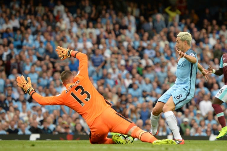 West Ham United's goalkeeper Adrian spreads himself to prevent Manchester City's midfielder Samir Nasri scoring on August 28, 2016