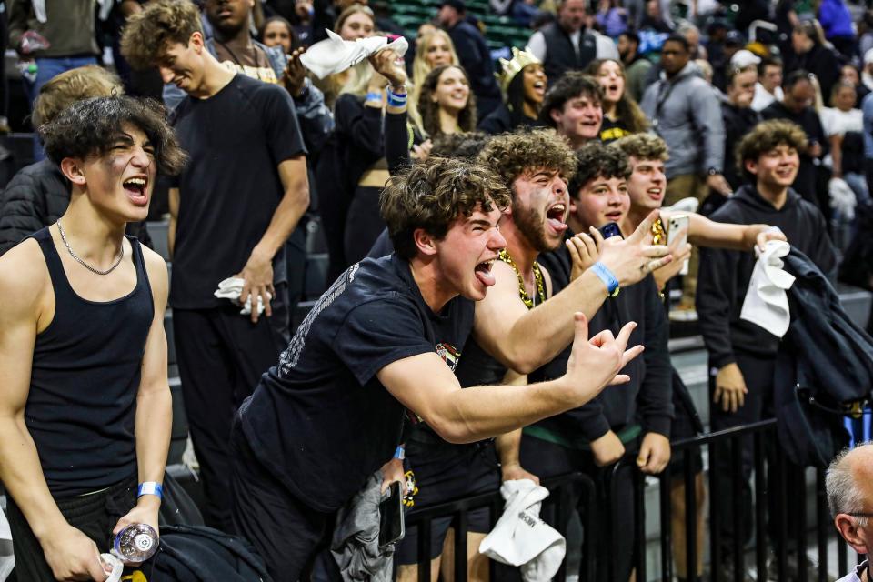 North Farmington fans celebrate the win against Zealand West during the MHSAA Division 1 boys basketball semifinals on Friday, March 15, 2024, at Breslin Center.