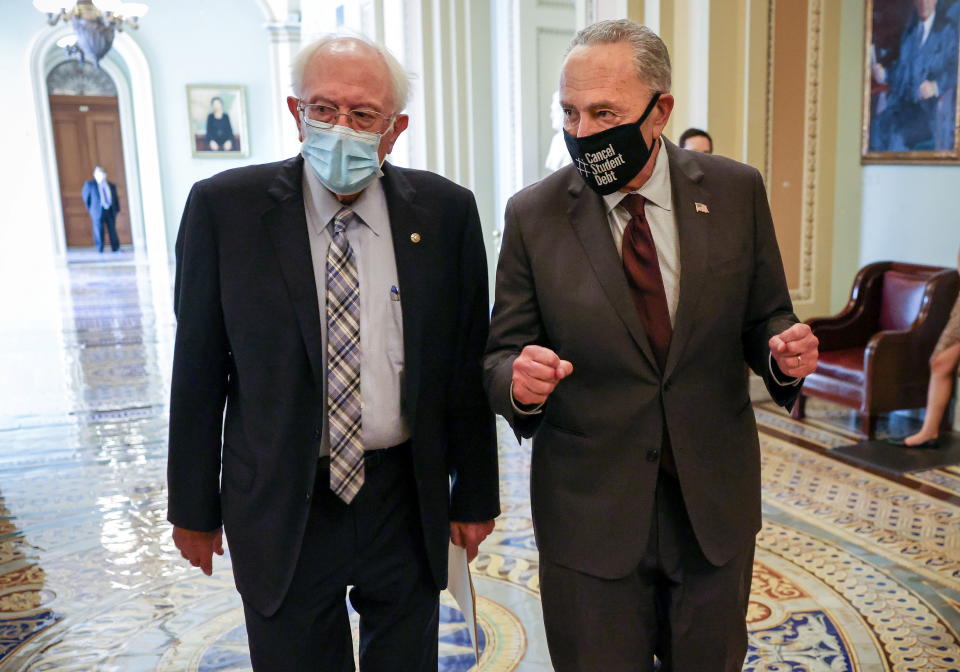 Chuck Schumer, right, and Bernie Sanders