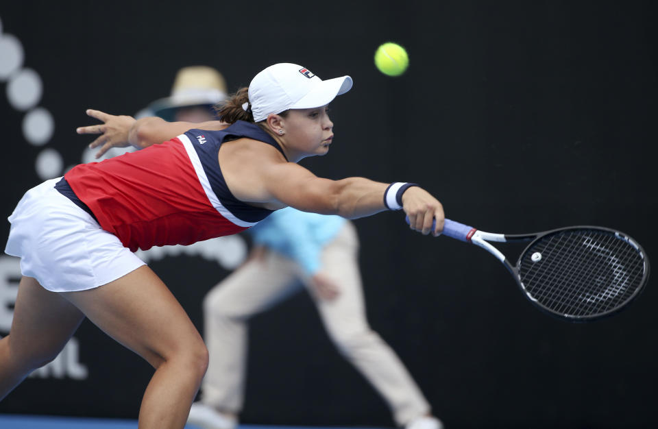 Ash Barty of Australia hits a backhand to Kiki Bertens of the Netherlands during their women's singles semifinal match at the Sydney International tennis tournament in Sydney, Friday, Jan. 11, 2019. (AP Photo/Rick Rycroft)