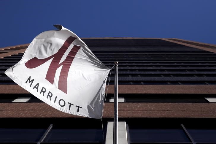 A Marriott flag hangs at the entrance of the New York Marriott Downtown hotel in Manhattan, New York (REUTERS/Andrew Kelly)