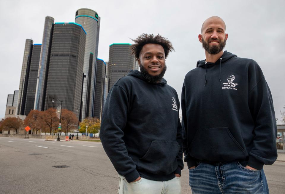 Omari Sankofa II, left, and Bryce Simon, hosts of "The Pistons Pulse" podcast, stand in downtown Detroit on Nov. 12, 2022.