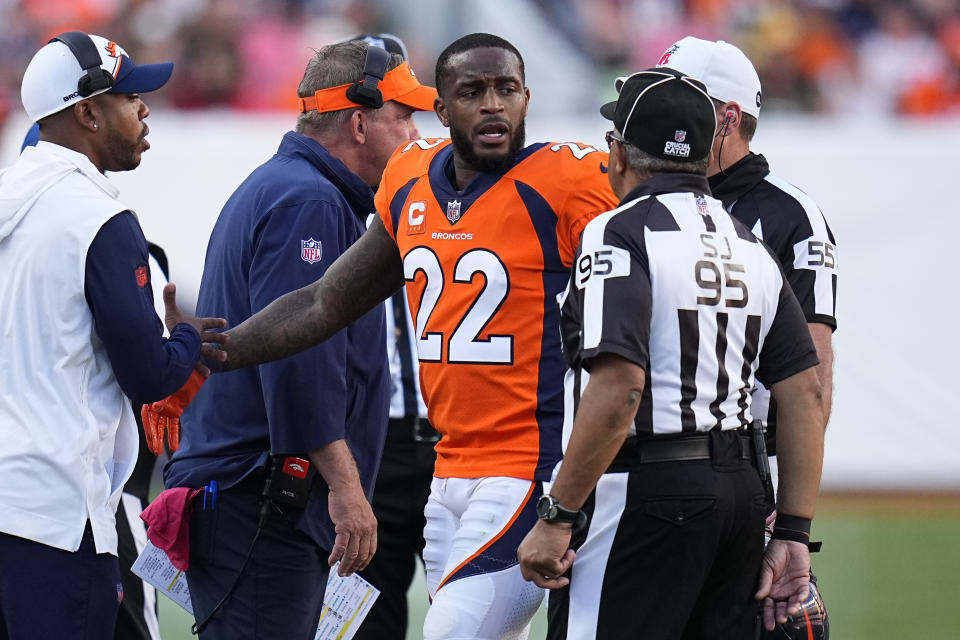 FILE -Denver Broncos safety Kareem Jackson (22) reacts to be disqualified from the game against the Green Bay Packers during an NFL football game Sunday, Oct. 22, 2023, in Denver. Broncos safety Kareem Jackson returned to practice Wednesday, Dec. 20, 2023 after completing his second suspension. Jackson missed Denver's last four games. Jackson has forfeited nearly $1 million in fines and paychecks over a series of over-the-top tackles this season.(AP Photo/Jack Dempsey, File)