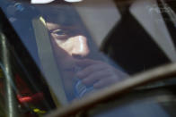 Santino Ferrucci take a drink of water as he sits in his car during a practice session for the Indianapolis 500 auto race at Indianapolis Motor Speedway, Friday, Aug. 14, 2020, in Indianapolis. (AP Photo/Darron Cummings)