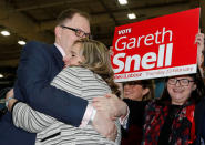 Labour party candidate Gareth Snell hugs his wife Sophia after winning the Stoke Central by-election in Stoke on Trent, February 24, 2017. REUTERS/Darren Staples