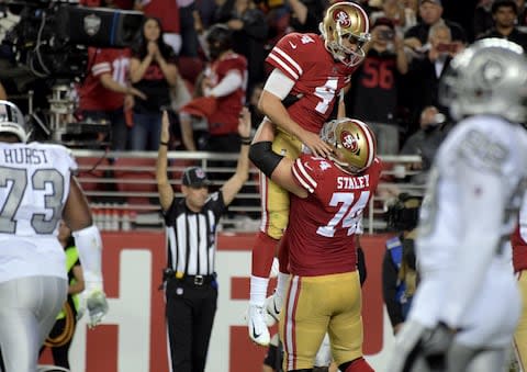 San Francisco 49ers offensive tackle Joe Staley (74) celebrates with San Francisco 49ers quarterback Nick Mullens (4) during the second half against the Oakland Raiders at Levi's Stadium - Credit: Kirby Lee/USA Today