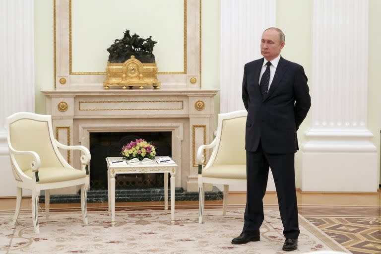 ILE - Russian President Vladimir Putin stands while waiting for Belarusian President Alexander Lukashenko prior to their talks in Moscow, on March 11, 2022. (Mikhail Klimentyev, Sputnik, Kremlin Pool Photo via AP, File