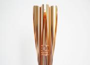 The Olympic torch of the Tokyo 2020 Olympic Games is displayed at a Torch Relay event to mark the 300-day milestone to the starting date of the torch relay, in Tokyo