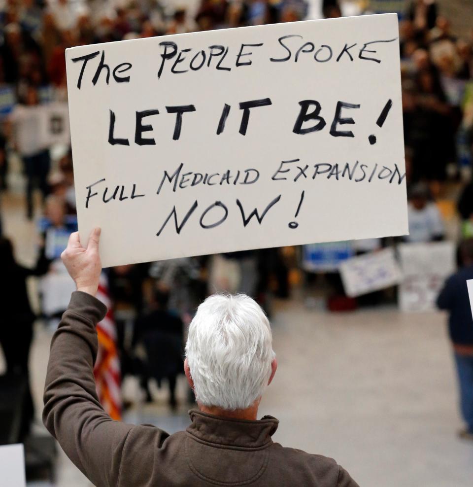 Supporters of a voter-approved measure to fully expand Medicaid gather at a rally to ask lawmakers not to change the law at the Utah State Capitol in Salt Lake City on Jan. 28. (Photo: AP Photo/Rick Bowmer)