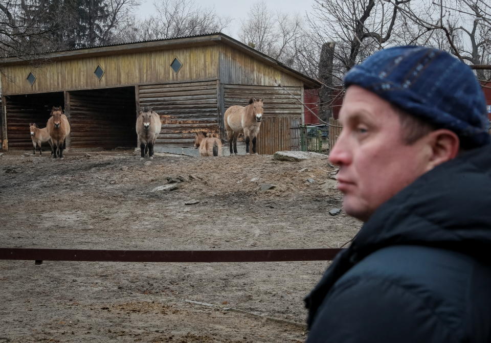 Trantin Kirill, zoo director, stands near an aviary with Przewalski's horses in the city zoo in Kyiv, Ukraine, March 3, 2022. REUTERS/Gleb Garanich