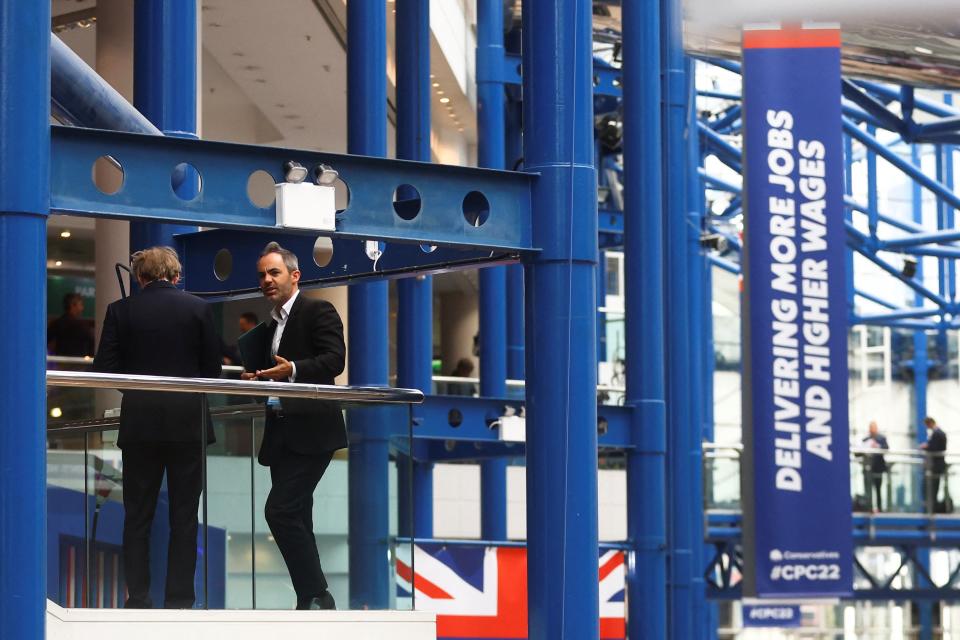 People gather at the conference center during Britain's Conservative Party's annual conference (REUTERS)