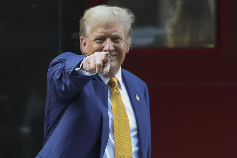 Former President Donald Trump motions as he departs a midtown Manhattan firehouse after meeting with firefighters,Thursday, May 2, 2024, in New York. (AP Photo/Yuki Iwamura)