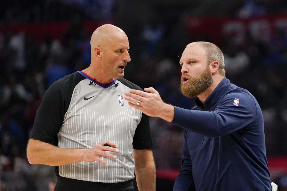 Memphis Grizzlies head coach Taylor Jenkins, right, argues with the referee during the first half of an NBA basketball game against the Los Angeles Clippers, Sunday, Nov. 12, 2023, in Los Angeles. (AP Photo/Ryan Sun)