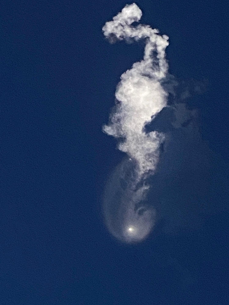 An iPhone captured a dramatic view of the Falcon 9 launch plume moments after the first stage fell away to begin its descent. / Credit: CBS News