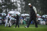 Tiger Woods walks on the 18th green during the weather delayed second round of the Masters golf tournament at Augusta National Golf Club on Saturday, April 8, 2023, in Augusta, Ga. (AP Photo/Matt Slocum)