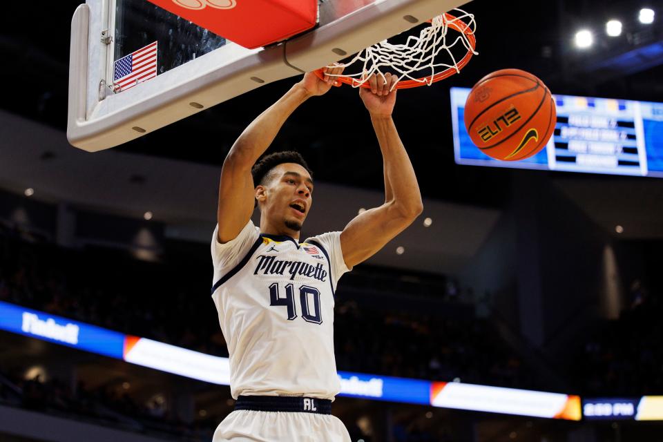 Jan 7, 2023; Milwaukee, Wisconsin, USA; Marquette Golden Eagles forward Keeyan Itejere (40) dunks during the second half against the Georgetown Hoyas at Fiserv Forum.