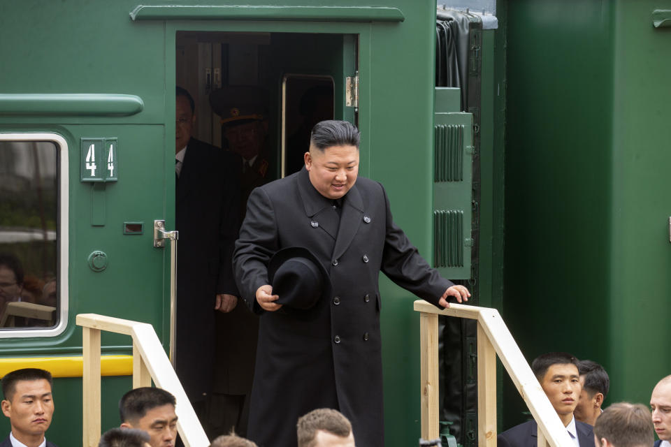 FILE - In this photo released by press office of the administration of Primorsky Krai region, North Korea's leader Kim Jong Un leaves a train carriage after arriving at the border station of Khasan, Primorsky Krai region, Russia, on April 24, 2019. North Korean leader Kim Jong Un’s possible trip to Russia might be like his first one in 2019, a rattling, 20-hour ride aboard a green-and-yellow armored train that is a quirky symbol of his family’s dynastic leadership.(Alexander Safronov/Press Office of the Primorye Territory Administration via AP, File)