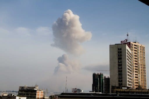 A plume of smoke rises over the Congolese capital Brazzaville, pictured from across the Congo River in Kinshasa, capital of neighbouring Democratic Republic of Congo. Congolese President Denis Sassou Nguesso announced a curfew in the area and set up an exclusion zone around the disaster site