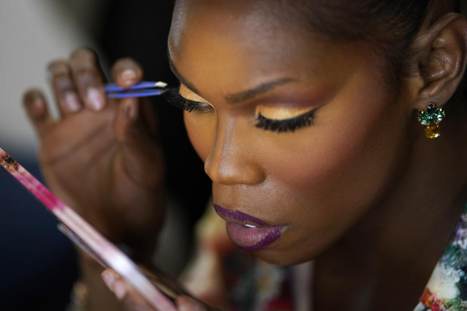 Chevis Regal applies eyelashes before the Mahu Magic drag show at the Western Regional Native Hawaiian Convention, Tuesday, June 20, 2023, in Las Vegas. (AP Photo/John Locher)