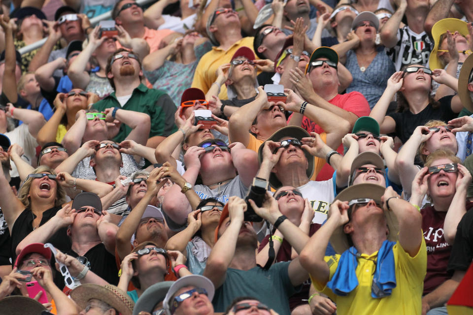 People watch the solar eclipse at Saluki Stadium on the campus of Southern Illinois University on Aug. 21, 2017 in Carbondale, Illinois. The city is also in the path of totality for the April 8, 2024 solar eclipse. / Credit: Scott Olson/Getty Images