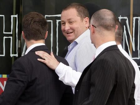 Mike Ashley leaves after the annual general meeting of Sports Direct in Shirebrook, central England, September 10, 2008. REUTERS/Darren Staples