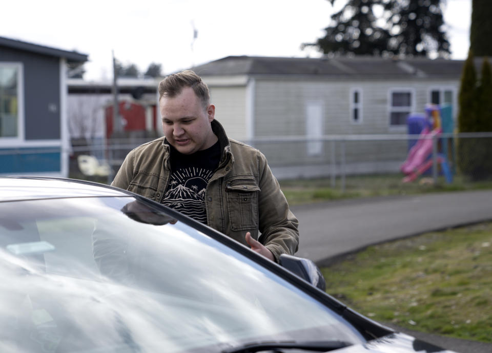 Gadiel Galvez, 22, talks with a neighbor at Bob’s and Jamestown Homeowners Cooperative, a resident-owned mobile home park in Lakewood, Wash., on Saturday, March 25, 2023. When residents learned the park’s owner was looking to sell, they formed a cooperative and bought it themselves amid worries it would be redeveloped. Since becoming owners in September 2022, residents have worked together to manage the park. (AP Photo/Lindsey Wasson)