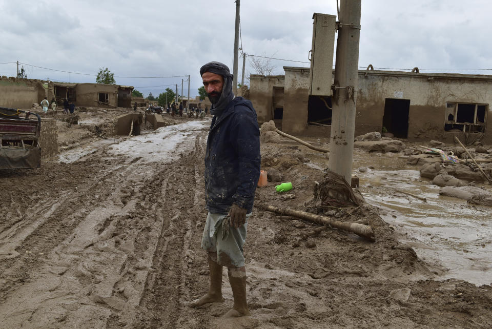 An Afghan man stands near his damaged home after heavy flooding in Baghlan province in northern Afghanistan Saturday, May 11, 2024. Flash floods from seasonal rains in Baghlan province in northern Afghanistan killed dozens of people on Friday, a Taliban official said. (AP Photo/Mehrab Ibrahimi)