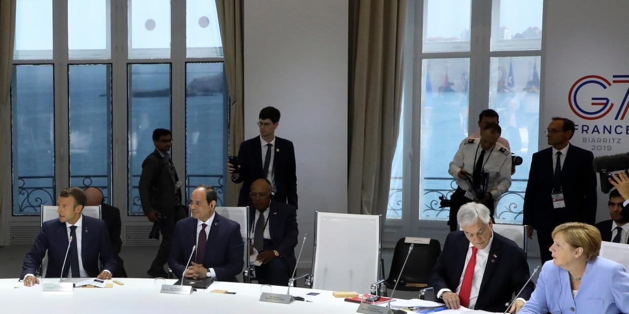 From the left, French President Emmanuel Macron, Egyptian President and Chairman of the African Union Abdel Fattah al-Sissi, Chile's President Sebastian Pinera and German Chancellor Angela Merkel attend a work session focused on climate in Biarritz, southwestern France, Monday Aug. 26, 2019, on the third day of the annual G7 Summit. The empty seat at third right was the place reserved for President Donald Trump, who according to Macron had skipped Monday's working session on the climate. At the same time Macron said that Trump supported an initiative by G-7 countries for an immediate $20 million fund to help Amazon countries fight wildfires and launch a long-term global initiative to protect the rainforest. (Ludovic Marin, Pool via AP)