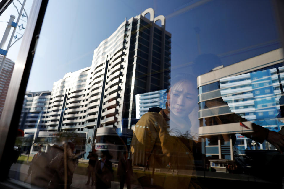 Passengers ride the bus in newly constructed area in central Pyongyang, April 12, 2017.