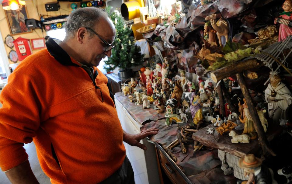 Mo Girgis, owner of King Tut Grill in South Knoxville, has built a unique collection into a Nativity scene along a wall in his eatery.