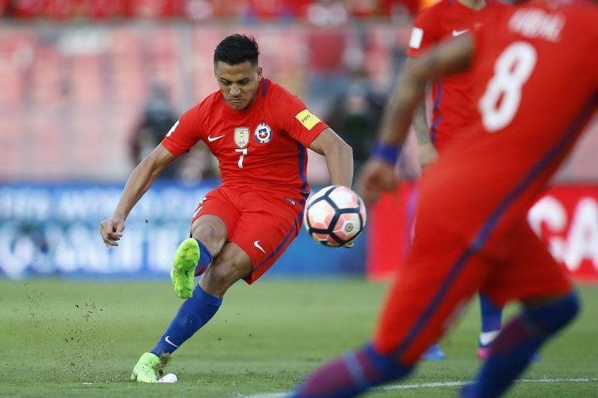 Sanchez curls in Chile's opener, his 37th for La Roja (EPA)