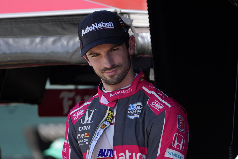 Alexander Rossi waits before practice for the IndyCar Detroit Grand Prix auto racing doubleheader on Belle Isle in Detroit, Friday, June 11, 2021. (AP Photo/Paul Sancya)