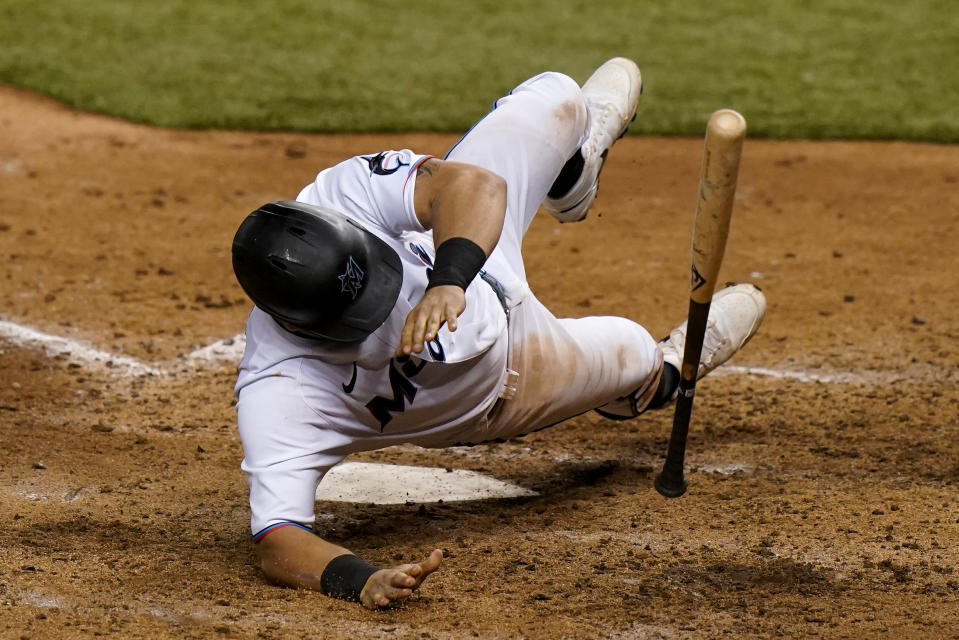 Miami Marlins' Francisco Cervelli (29) falls to the field on a close pitch thrown by New York Mets relief pitcher Dellin Betances during the eighth inning of a baseball game, Wednesday, Aug. 19, 2020, in Miami. (AP Photo/Lynne Sladky)