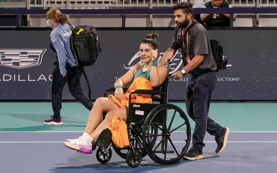 Bianca Andreescu leaves court in a wheelchair – Bianca Andreescu screams in pain after collapsing with fresh ankle injury - Alamy/Debby Wong