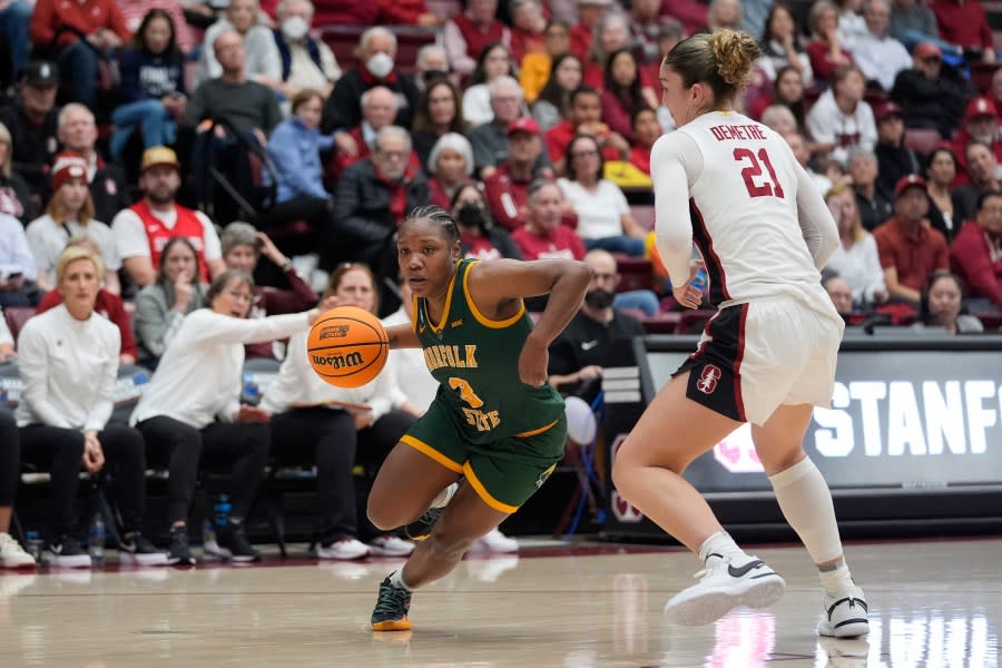 Norfolk State guard Diamond Johnson, left, moves the ball while defended by Stanford forward Brooke Demetre during the first half of a first-round college basketball game in the women’s NCAA Tournament in Stanford, Calif., Friday, March 22, 2024. (AP Photo/Godofredo A. Vásquez)