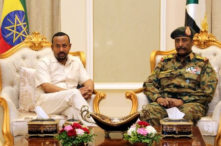 Ethiopian Prime Minister Abiy Ahmed meets Sudan's Head Of Transitional Military Council, Lieutenant General Abdel Fattah Al-Burhan Abdelrahman to mediate in the political crisis at the airport in Khartoum