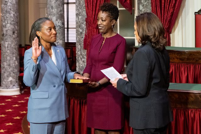 <p>Bill Clark/CQ-Roll Call, Inc via Getty</p> Laphonza Butler is sworn in to the U.S. Senate by Vice President Kamala Harris, as her wife, Neneki Lee, holds a Bible
