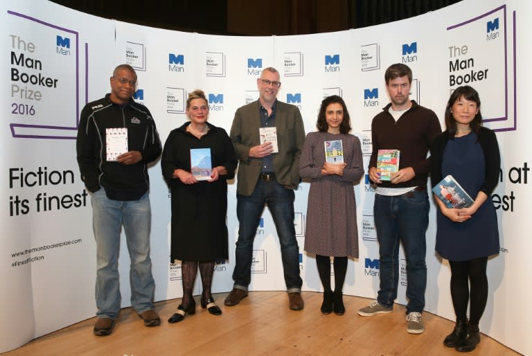 (Left to right) US author Paul Beatty, British author Deborah Levy, British author Graeme Macrae Burnet, US author Ottessa Moshfegh, Canadian-born British author David Szalay and Canadian author Madeleine Thien hold their books