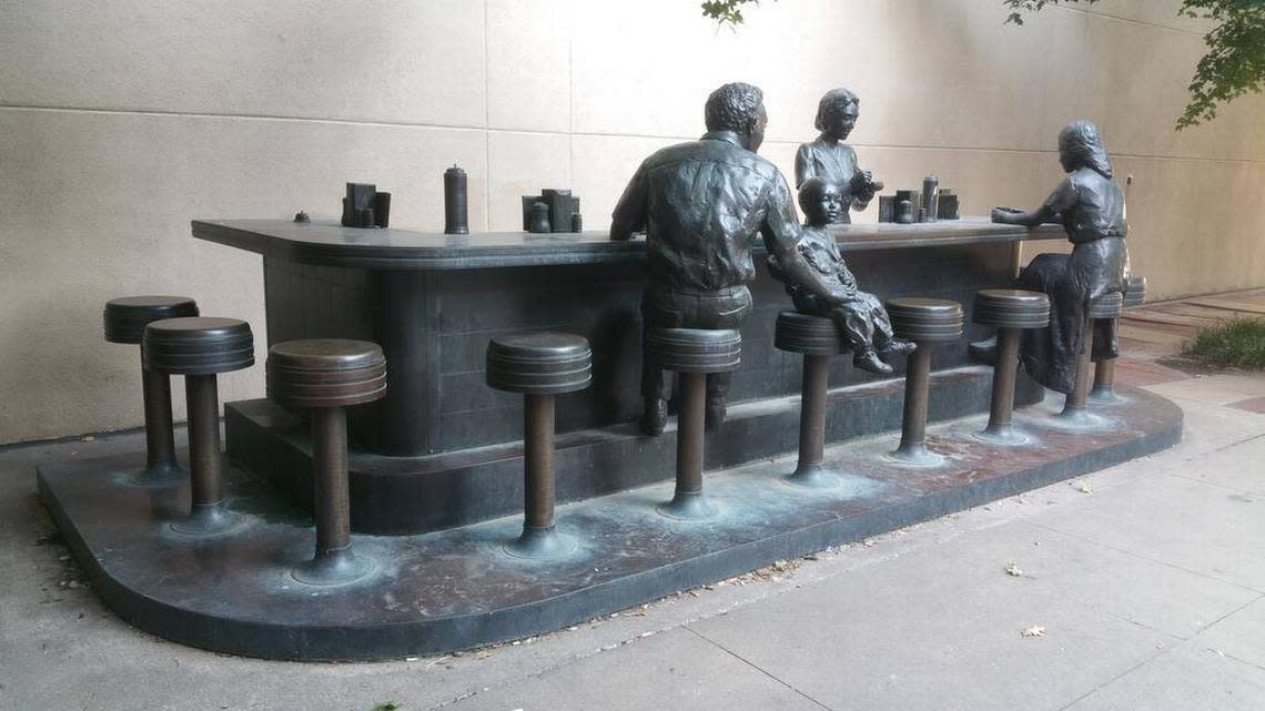 This bronze sculpture commemorates the 1958 Dockum Drugs sit-in, which took place at the corner of Douglas and Broadway.