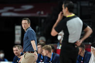 Slovenia head coach Aleksander Sekulic, left, questions a call during a men's basketball semifinal round game against France at the 2020 Summer Olympics, Thursday, Aug. 5, 2021, in Saitama, Japan. (AP Photo/Charlie Neibergall)