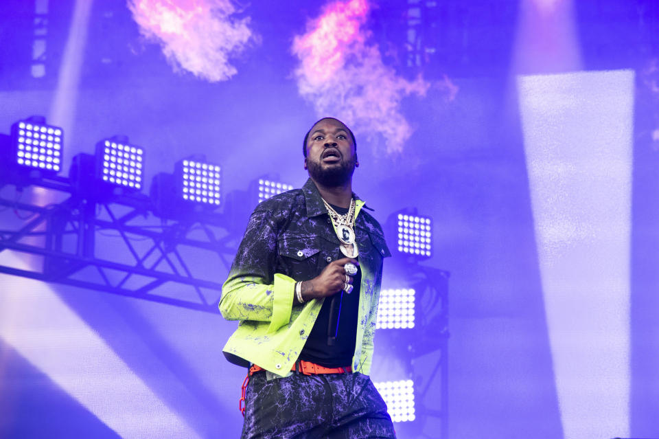 FILE - In this Sunday, Aug. 4, 2019 file photo, Meek Mill performs on day four of Lollapalooza in Grant Park in Chicago. The NFL and Roc Nation announced Friday, Aug. 30, 2019, that Mill and Rapsody will perform in a free pregame concert Sept 5 before the season-opening game between the Green Bay Packers and Chicago Bears. The concert is an early sign of how the league’s new social justice partnership with rapper Jay-Z and his label may work out. (Photo by Amy Harris/Invision/AP, File)