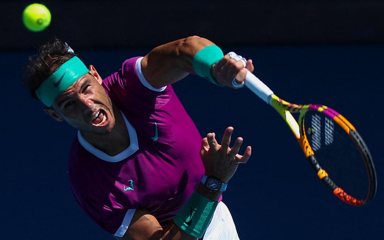 Spain's Rafael Nadal serves against France's Adrian Mannarino during their men's singles match on day seven of the Australian Open tennis tournament in Melbourne on January 23, 2022 - AFP