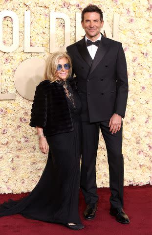 <p>Amy Sussman/Getty</p> Bradley Cooper and his mom Gloria Campano at Golden Globes on Jan. 7, 2024.