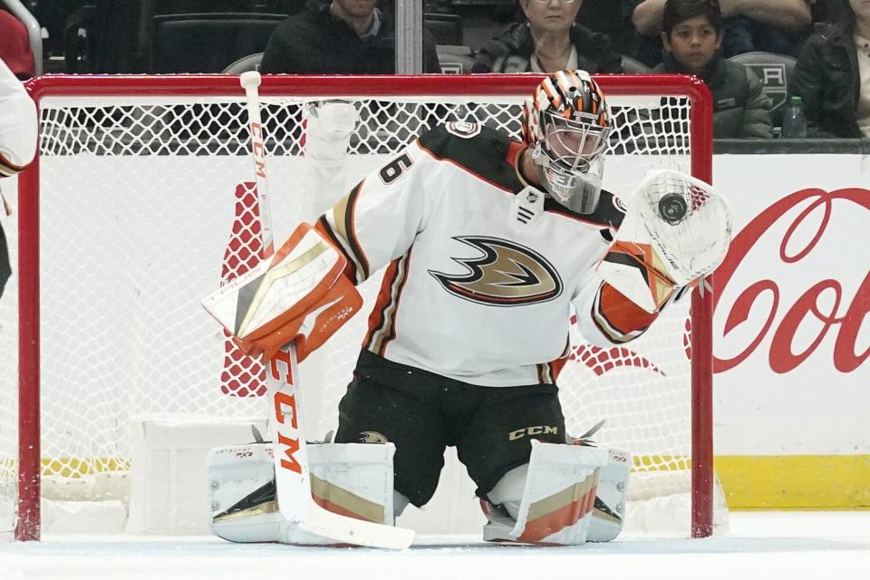 Ducks goaltender John Gibson makes a glove save during a preseason game against the Kings on Saturday.