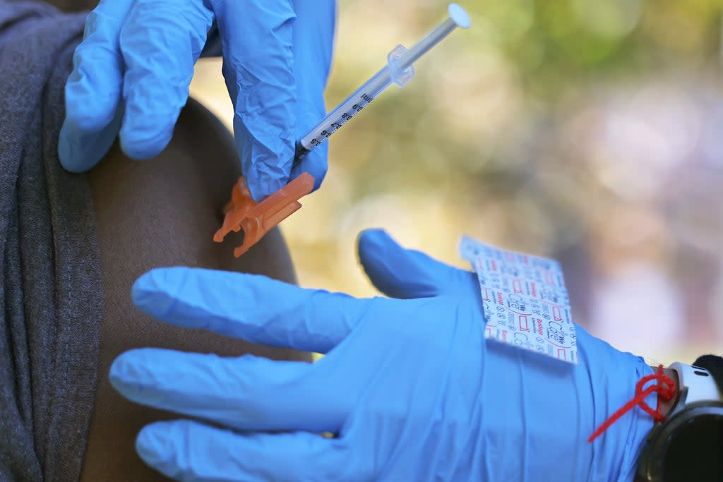 A person receives the Pfizer-BioNTech coronavirus vaccine at a  site at Life of Hope Center on 21 October 2021 in New York City (Getty Images)