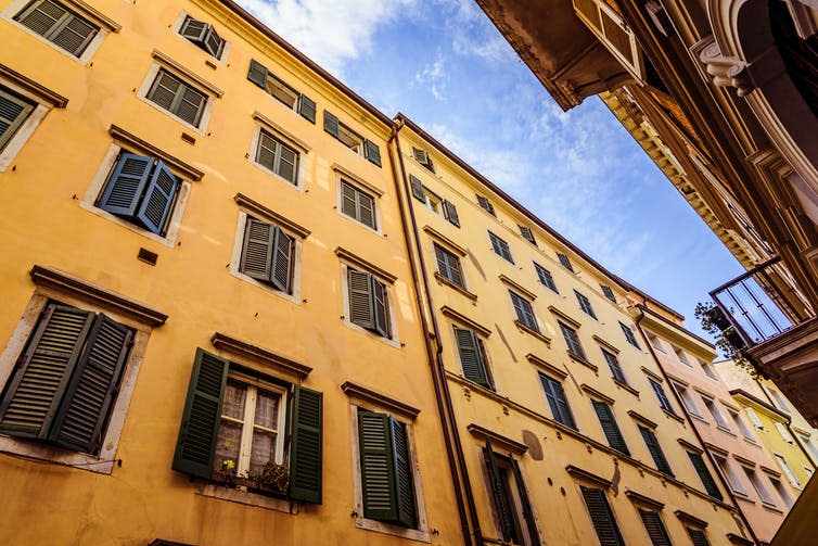 <span class="caption">Shutters can bring shade during the hottest moments of the day.</span> <span class="attribution"><a class="link " href="https://www.shutterstock.com/image-photo/big-old-yeloow-building-italian-style-1720087039" rel="nofollow noopener" target="_blank" data-ylk="slk:Vlad Zymovin/Shutterstock;elm:context_link;itc:0;sec:content-canvas">Vlad Zymovin/Shutterstock</a></span>